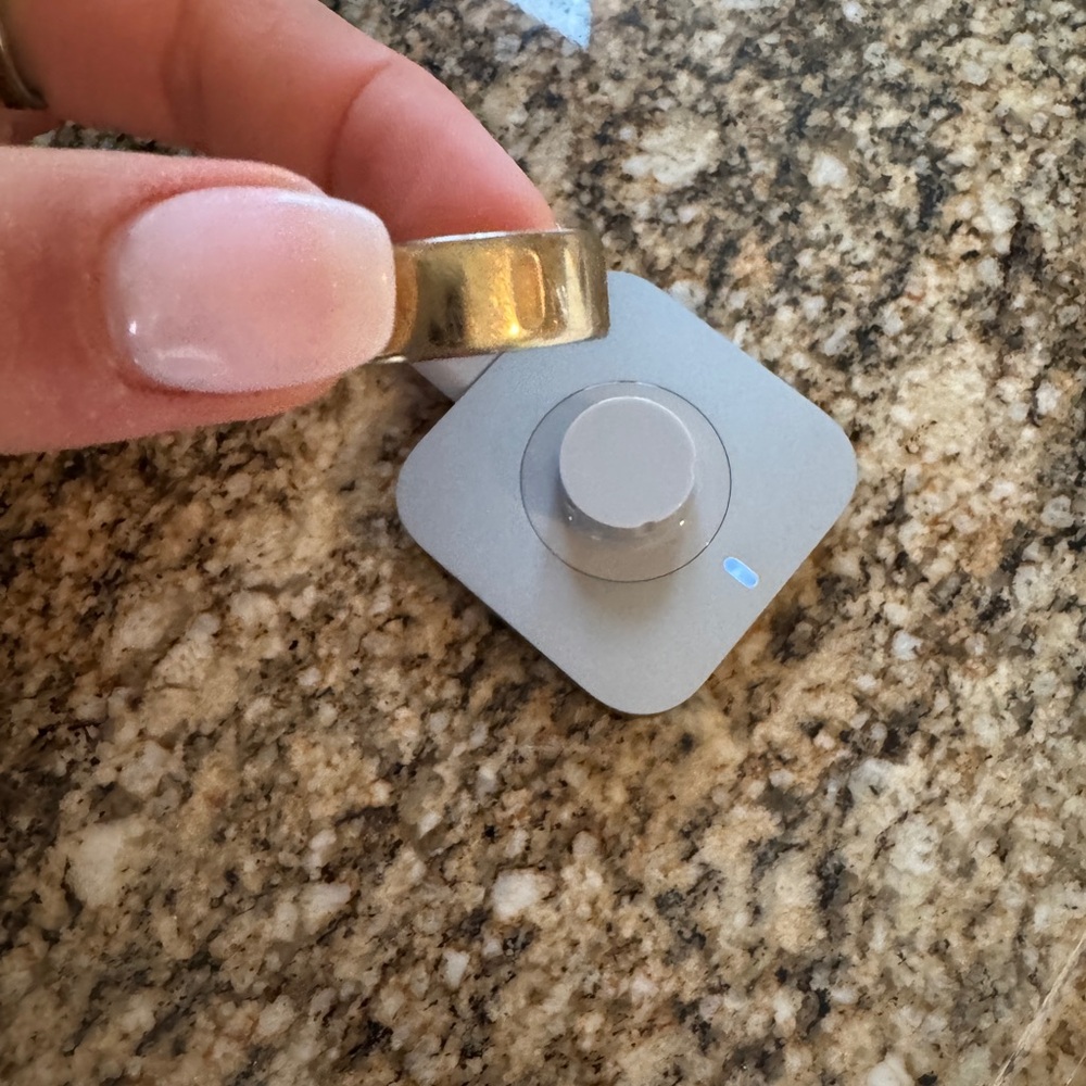 Gold Oura ring and Charger